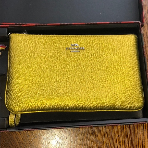 Coach Handbags - Coach Wizard of Oz Wristlet w/ charms NWT